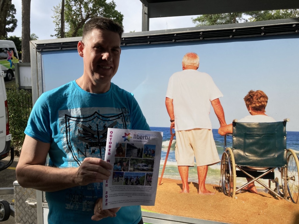 Daniel holding liberty brochure photo