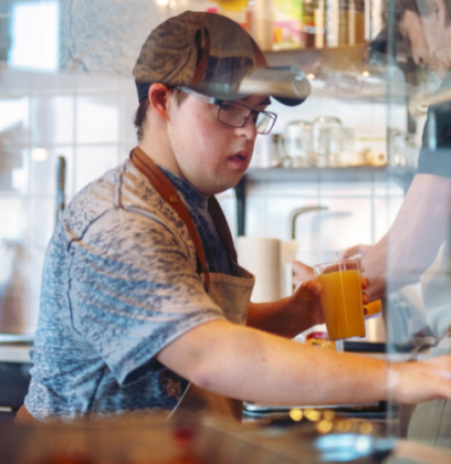 Hospitality industry disability employment person with downs syndrome working in Cafe