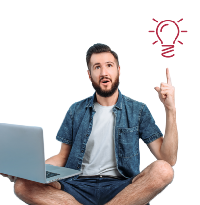 Turning rejection into opportunity, guy sitting with laptop pointing at a bright idea bulb