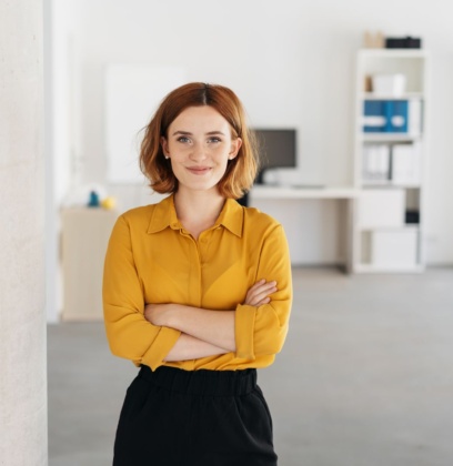 Cheerful Disability Employment Services Provider Standing In Office