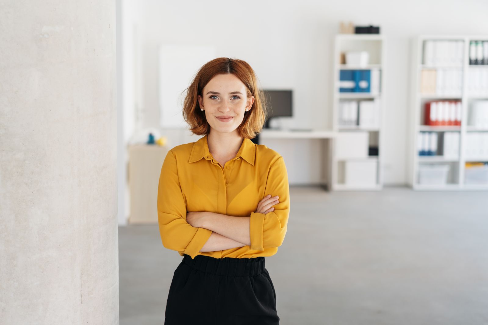 Cheerful Disability Employment Services Provider Standing In Office