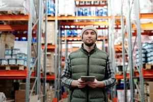 Man Standing At Factory Job