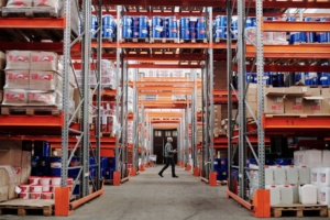 Man Walking Through A Factory