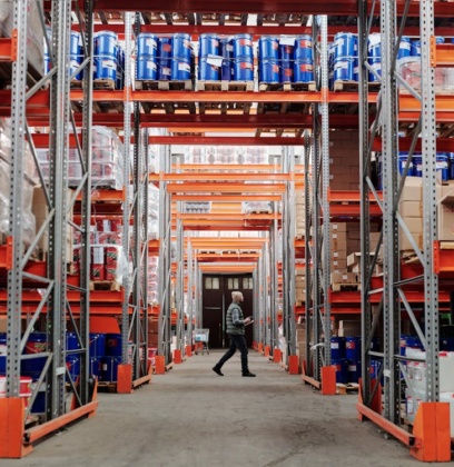 Man Walking Through A Factory