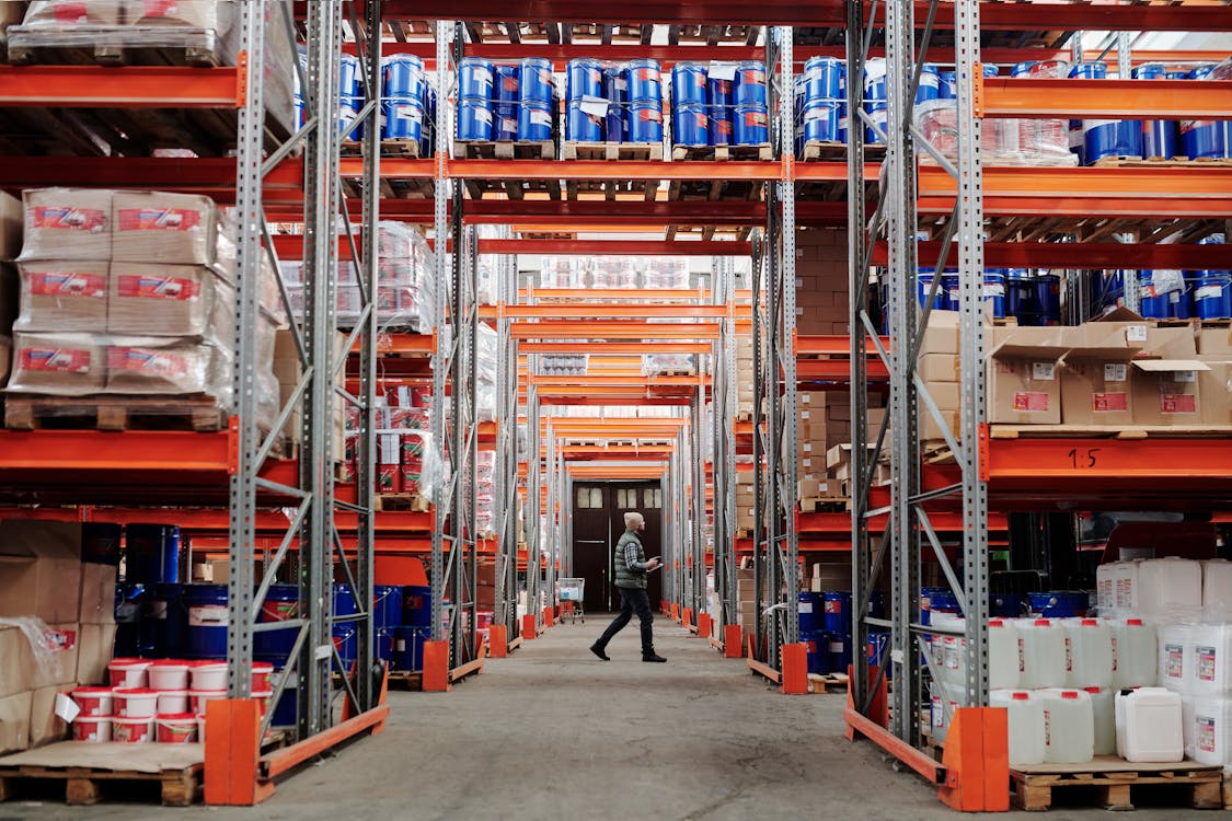 Man Walking Through A Factory