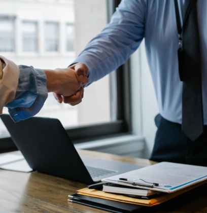 Colleagues Shaking Hands In Office