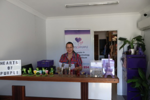 Michelle standing in reception at Hears of Purple