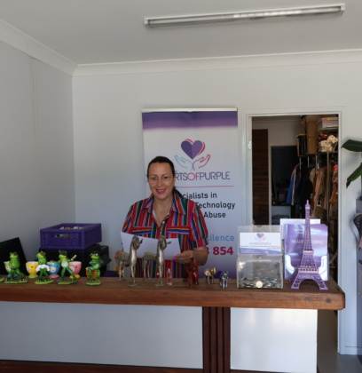 Michelle standing in reception at Hears of Purple