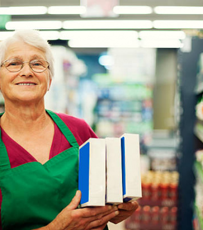 Senior Woman Working At Supermarket
